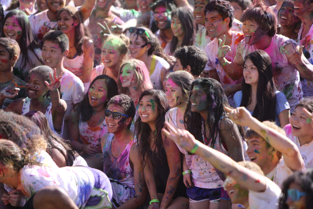 Students gathered in a crowd to celebrate Holi