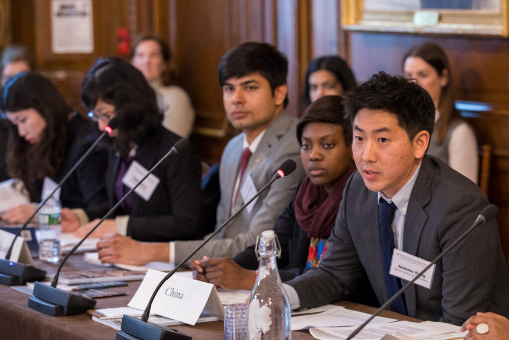 Scholars participate in a mock United Nations Security Council meeting