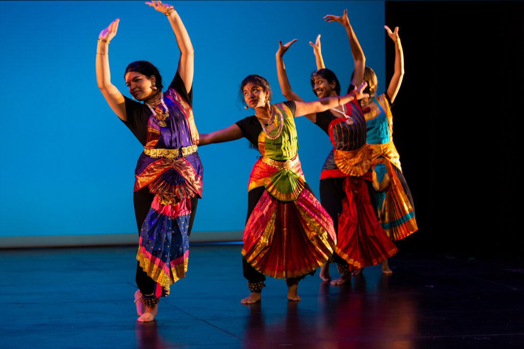 Performers on stage dancing during Diwali