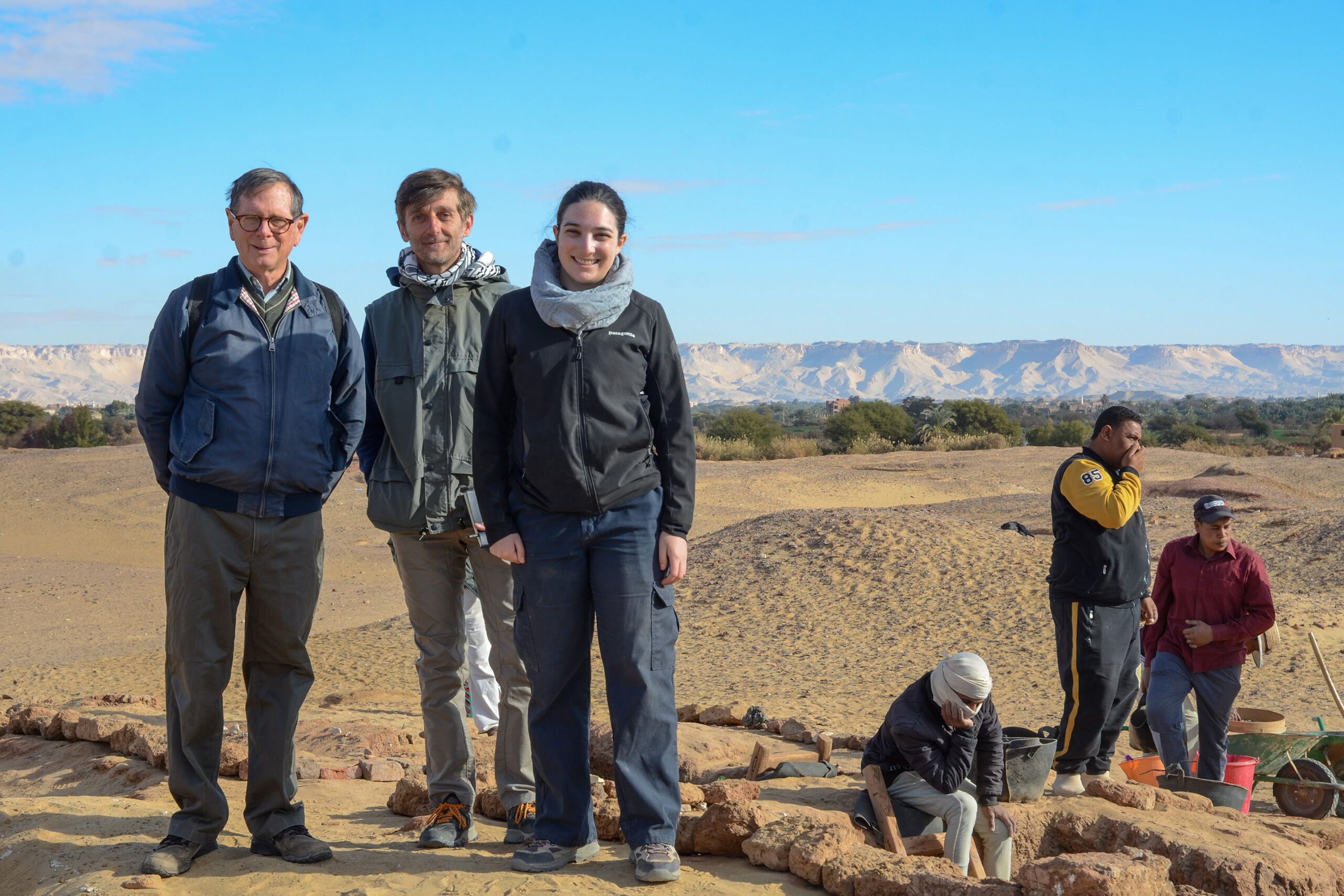 Graduate student Harper Tooch (center) and Professor Nicola Aravecchia at the Egyptian excavation site of Amheida, located in the Dakhla Oasis.