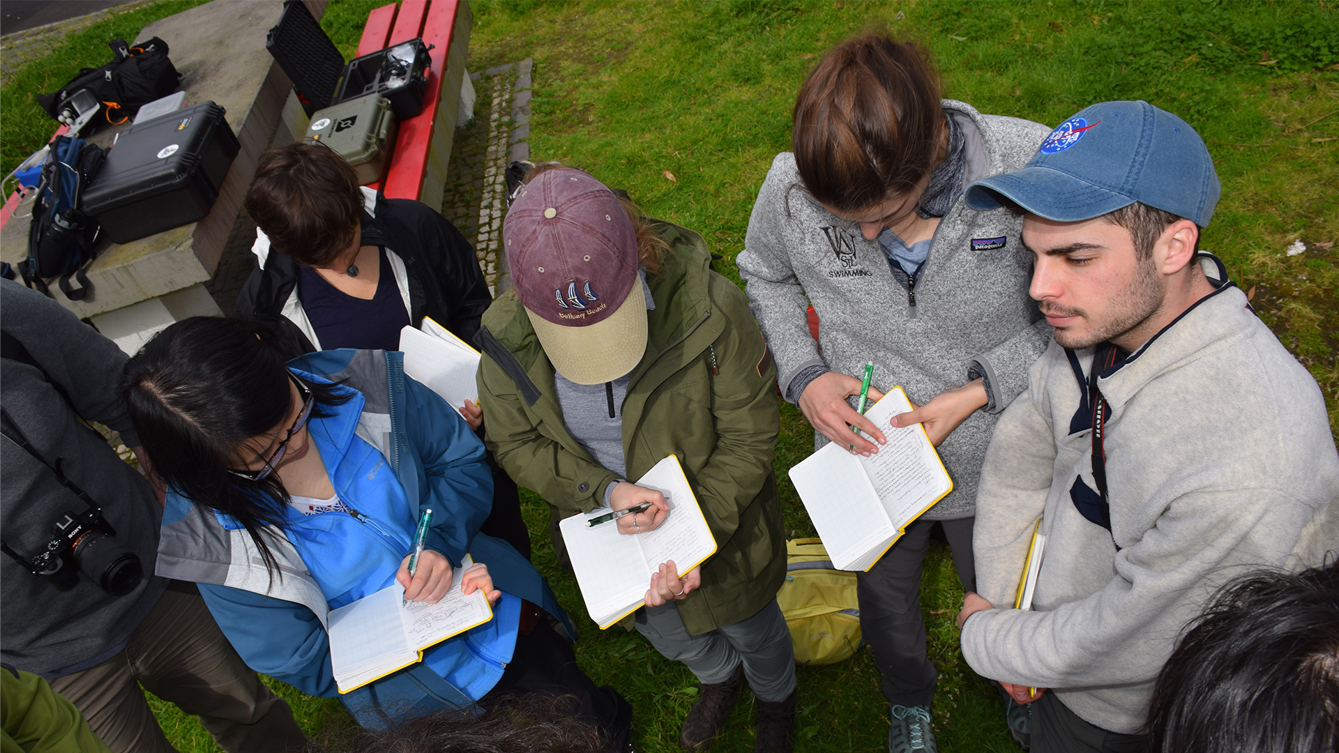 Geology students take notes during a class field trip to the Azores